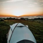 Camping tent set up outdoors, representing proper tent storage and maintenance tips