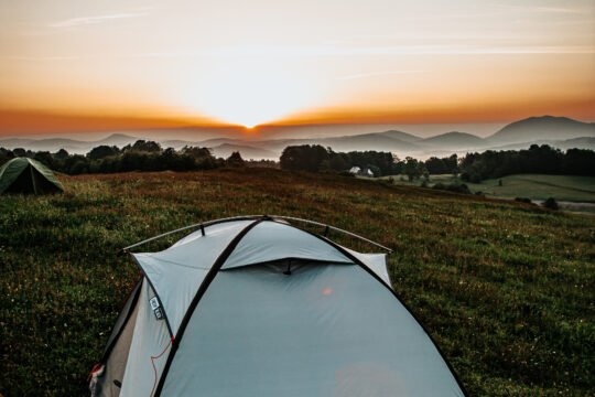 Camping tent set up outdoors, representing proper tent storage and maintenance tips
