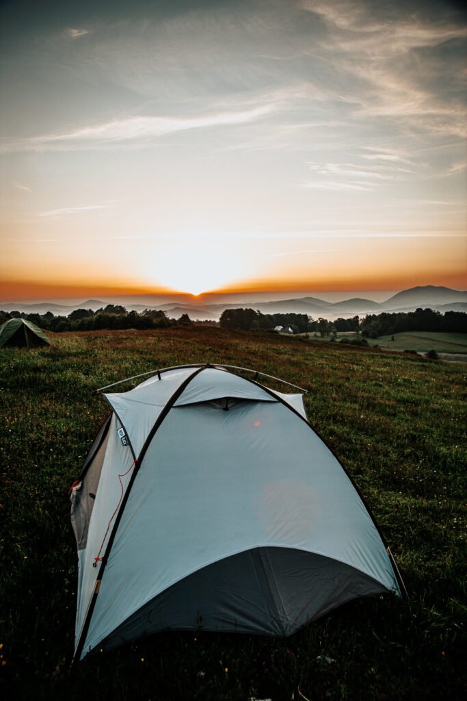 Camping tent set up outdoors, representing proper tent storage and maintenance tips