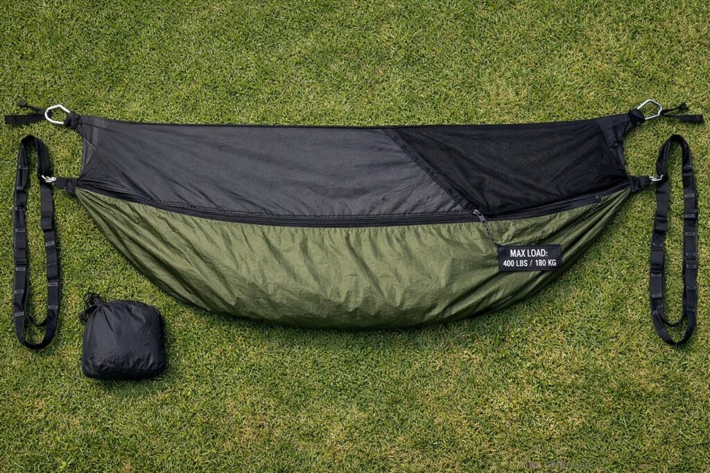 Camping hammock selection guide — double ripstop nylon hammock with weight capacity label, daisy chain straps, and integrated bug net laid out for comparison